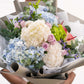 Freshly cut flowers being wrapped for delivery in Bangalore